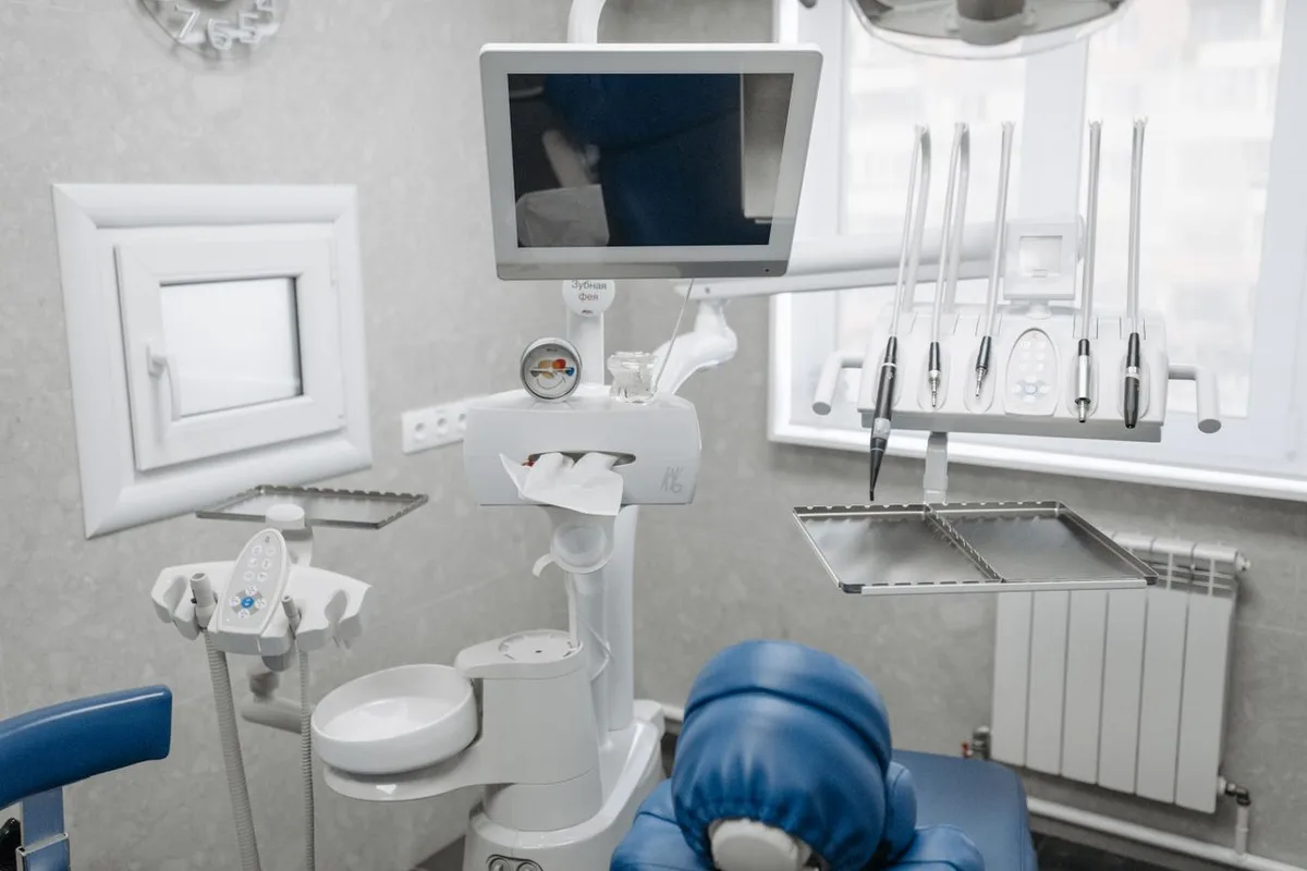 A clean, modern dental treatment room with up-to-date equipment